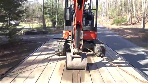 chaining down a mini excavator|chain down a mini excavator.